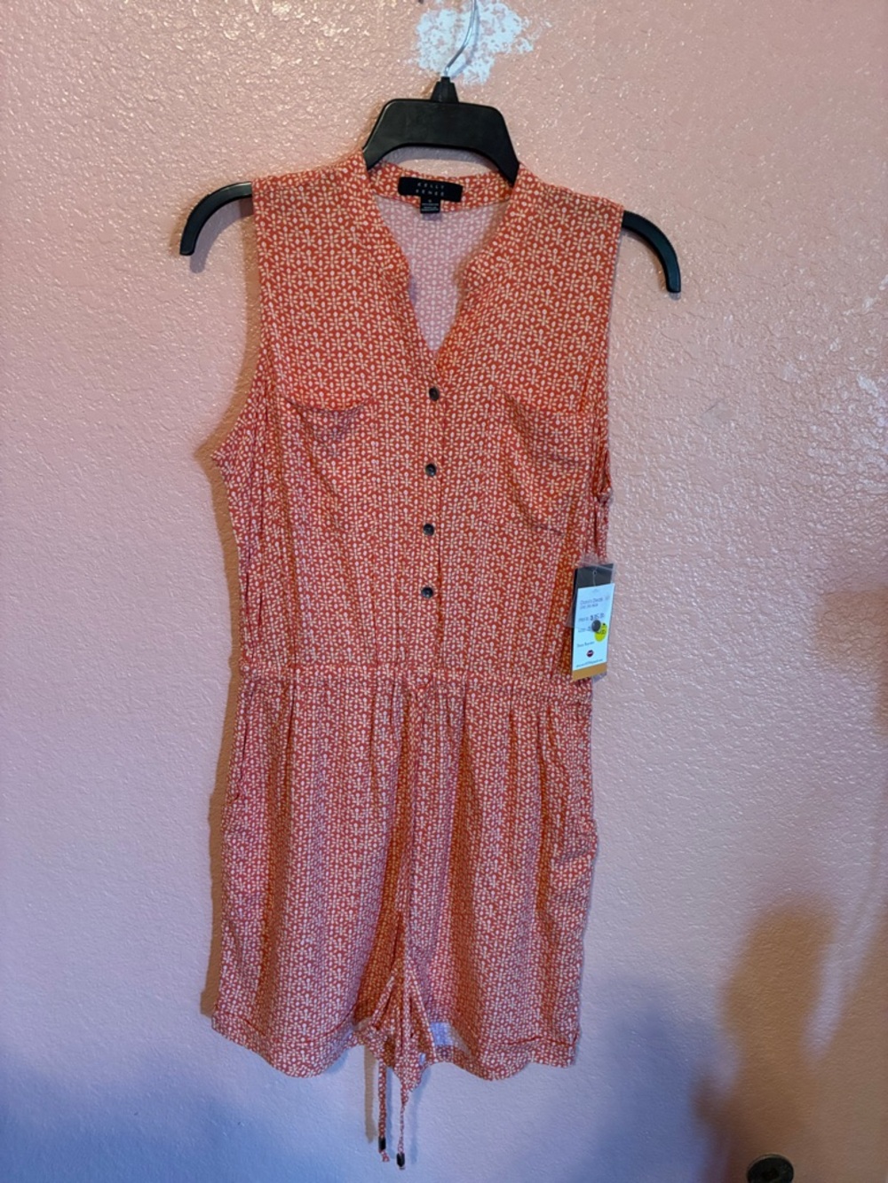 Sleeveless Orange Printed Romper with Button Front